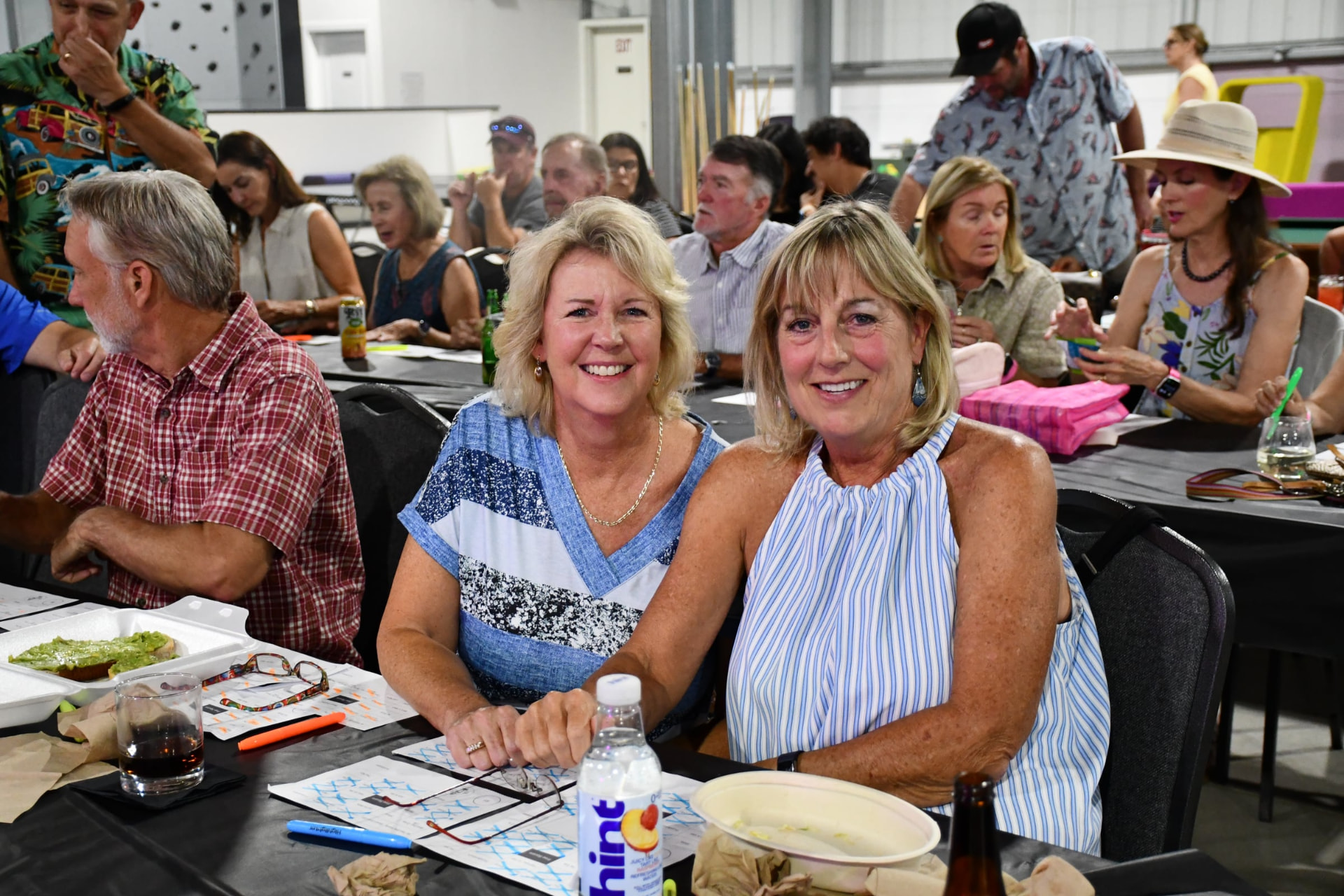 Friends smiling at Music Bingo