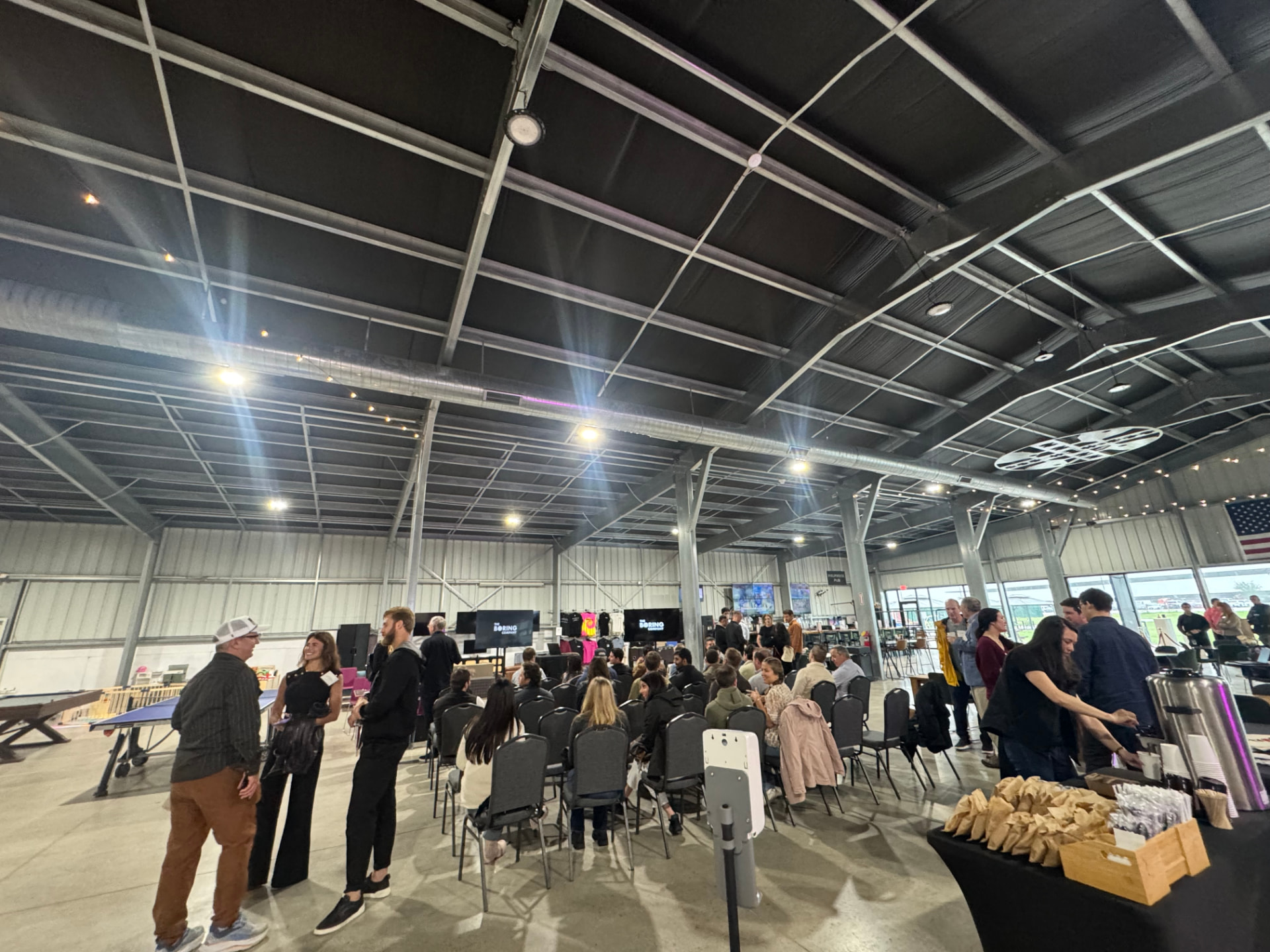 Community gathering in the Hyperloop Plaza hall