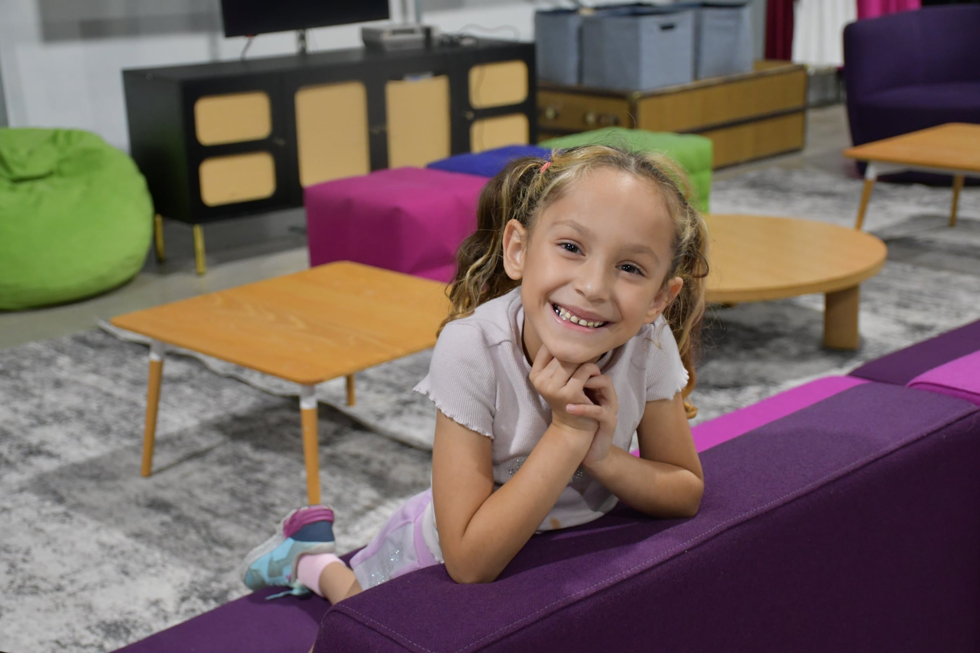 Child smiling in the kids lounge